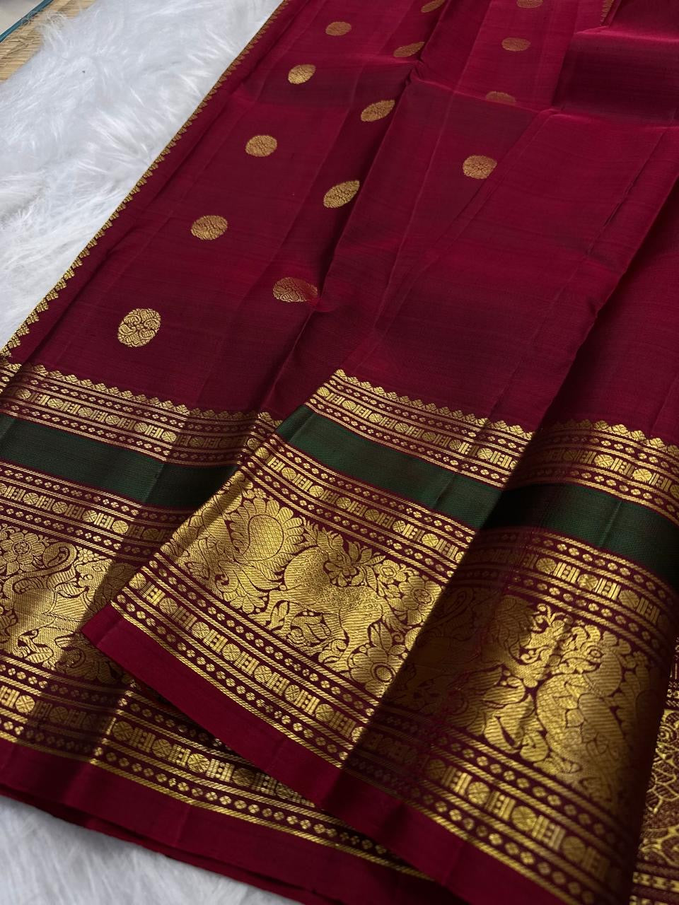 Peacock Blue and Maroon Handwoven Pure Silk Kancheepuram Saree with Maanga Butta and Gandaberunda Border