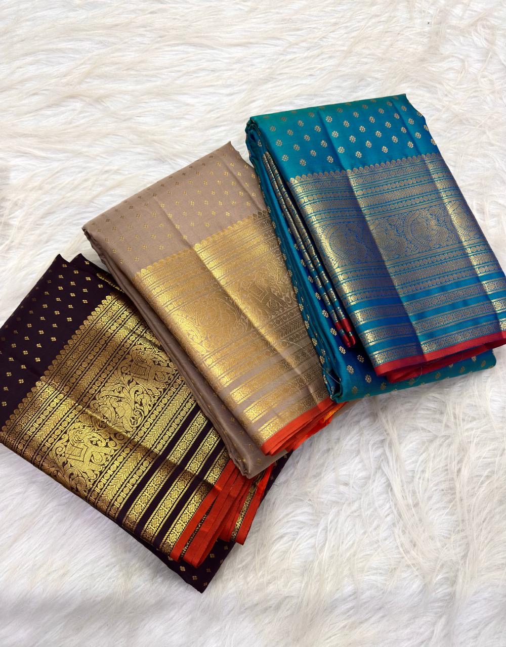 Sapphire Blue Kanchi Pattu saree with fine handwoven gold zari buttas across the body.