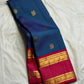 Peacock Blue pure silk Kanchi Pattu Rettapet saree with Rani Pink Korvai gold zari border.