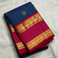 Peacock Blue Kanchipuram silk saree with alternating Mayil and Chakram gold zari buttas.