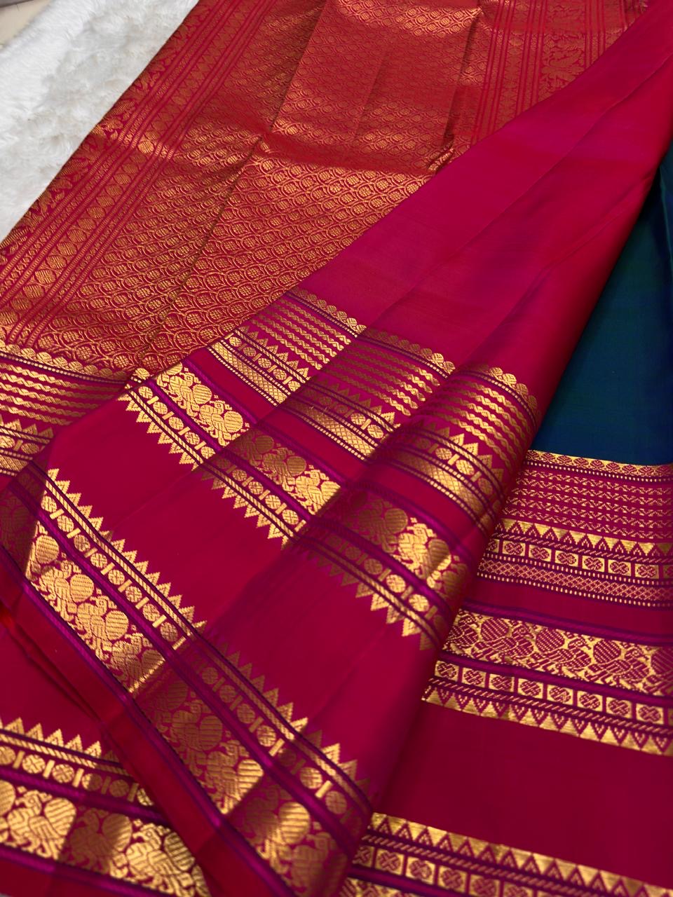 Peacock Blue Handwoven Pure Silk Kanjivaram Saree with Varisaipet Chedi Butta and Korvai Magenta Border