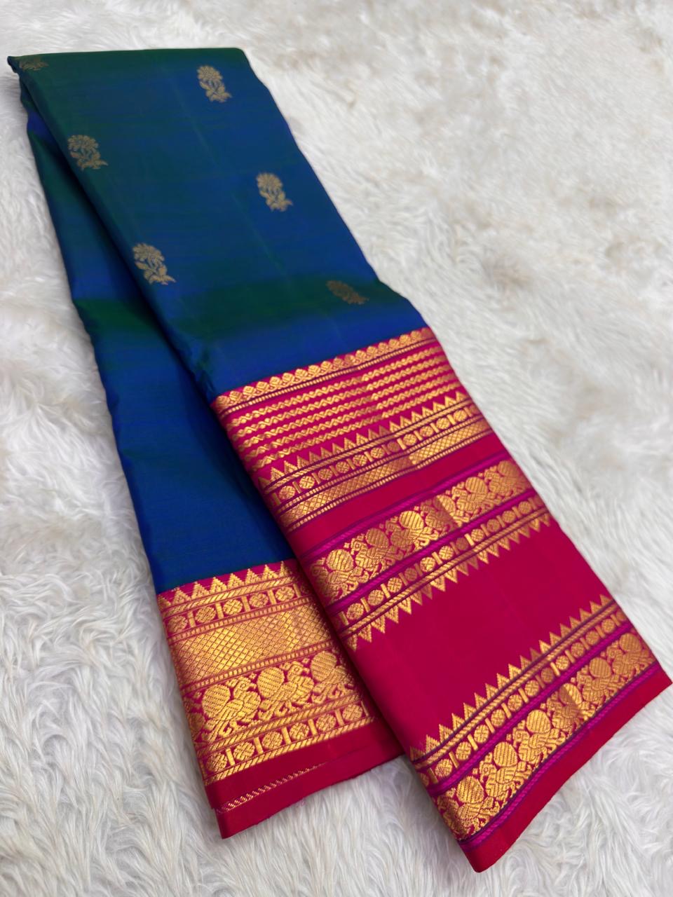Peacock Blue Handwoven Pure Silk Kanjivaram Saree with Varisaipet Chedi Butta and Korvai Magenta Border