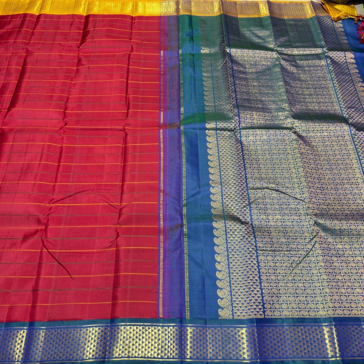 Peacock blue and golden yellow Korvai border on a Kancheepuram silk saree