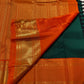 Peacock-eye Mayilkann motif in gold zari border on Kanchipuram saree