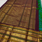 Close view of Varisaipet border with maroon, forest-green and multiple handwoven gold zari motif stripes.