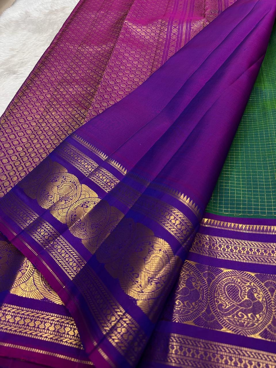 traditional tested zari detail on peacock green Kanchipuram silk saree