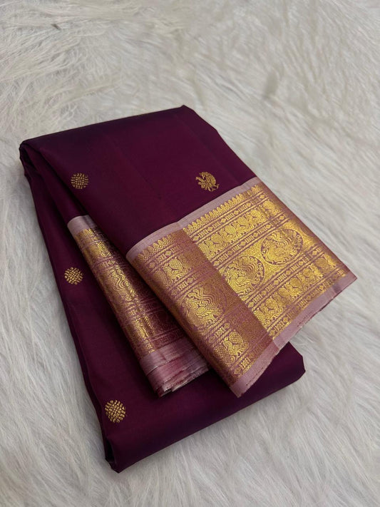 Royal plum Pure Silk KanchiPattu saree with peacock and lotus Butta motifs