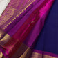 Antique-gold zari peacock medallions and ornamental detailing across the broad Vadamalli border.