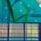 Iridescent peacock-neck blue and green pure silk Kanchipuram saree, gold varisaipet border yaanai birds; traditional Varisaipet weave.