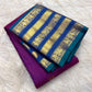 Blue-teal pallu with golden diamond lattice and floral zari panel on a Vadamalli magenta Kanchipuram saree