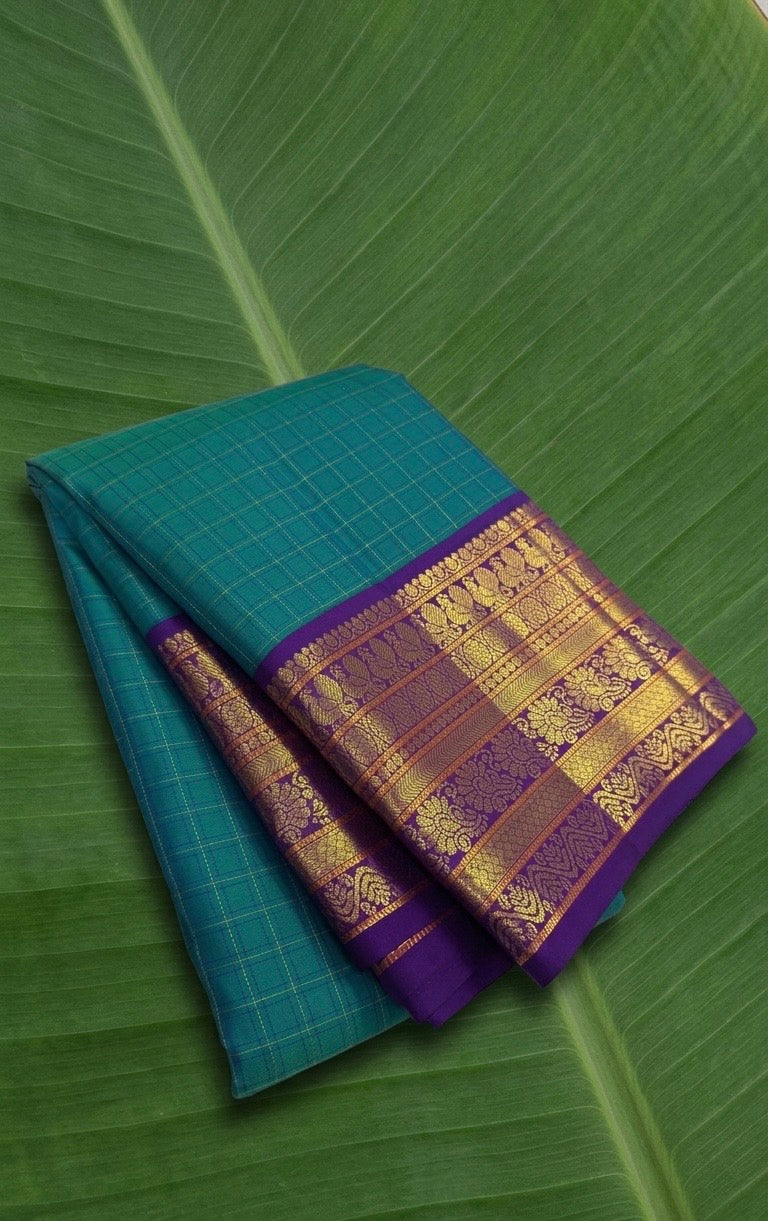 Pure Kanchipuram Korvai silk saree in peacock teal blue with royal purple contrast border