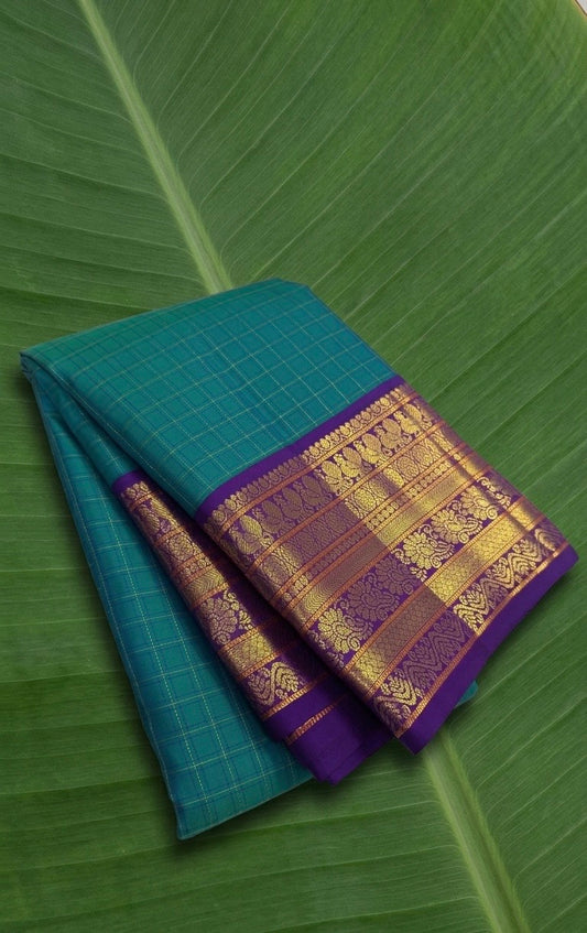 Pure Kanchipuram Korvai silk saree in peacock teal blue with royal purple contrast border
