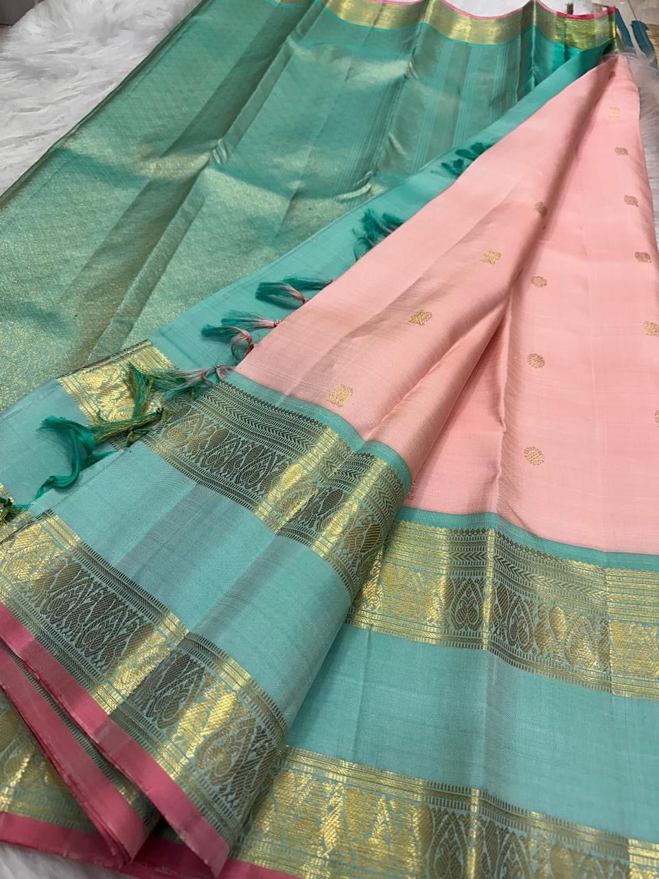 Peacock teal Rettapet border detail on blush rose Kanjivaram pure silk saree