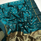 Peacock teal handloom Chanderi saree showing its fluid drape and floral details.