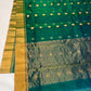 Close-up of floral buttas on the body of a peacock teal Chanderi saree