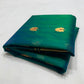 Broad gold border with fine blue-green stripes on peacock teal Chanderi saree