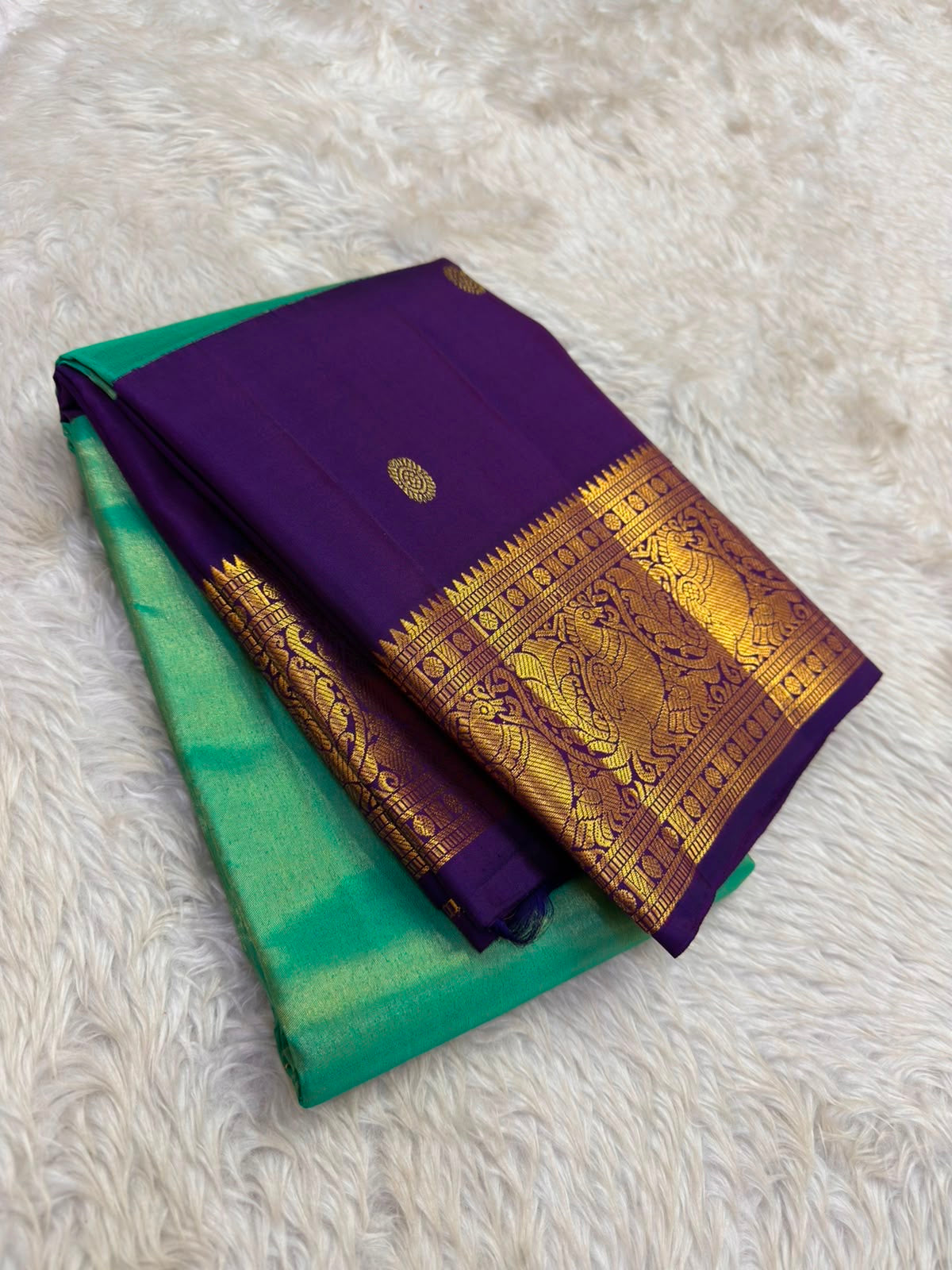 Vanasringaram gold zari motifs on deep purple korvai border of peacock teal Kanchipuram saree — Idam Living