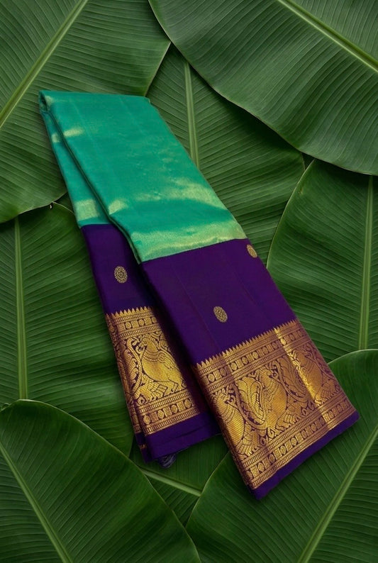 Peacock teal handwoven Kanchipuram pure silk saree with kamalam butta and deep purple korvai border — Idam Living