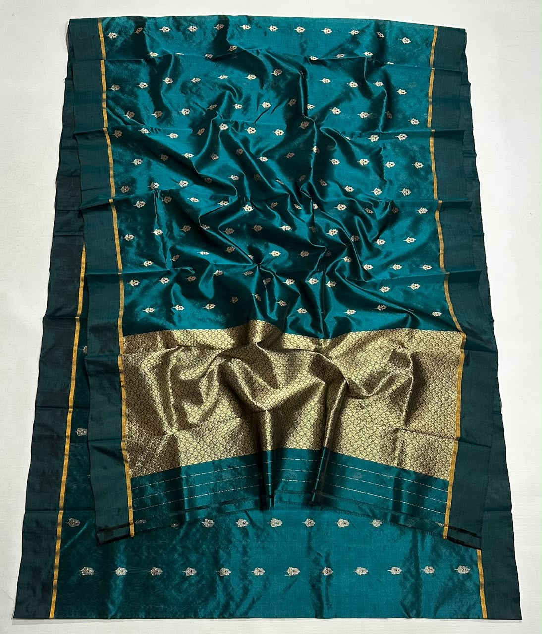 Peacock teal Pattu Silk Chanderi handloom saree with gold pallu and deep teal borders.