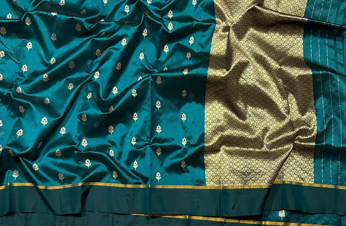Fine repeated geometric gold weaving on the Chanderi saree pallu.