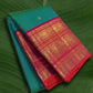 Kanchipuram silk saree in peacock teal with rani pink border Korvai Varisaipet weave folded view