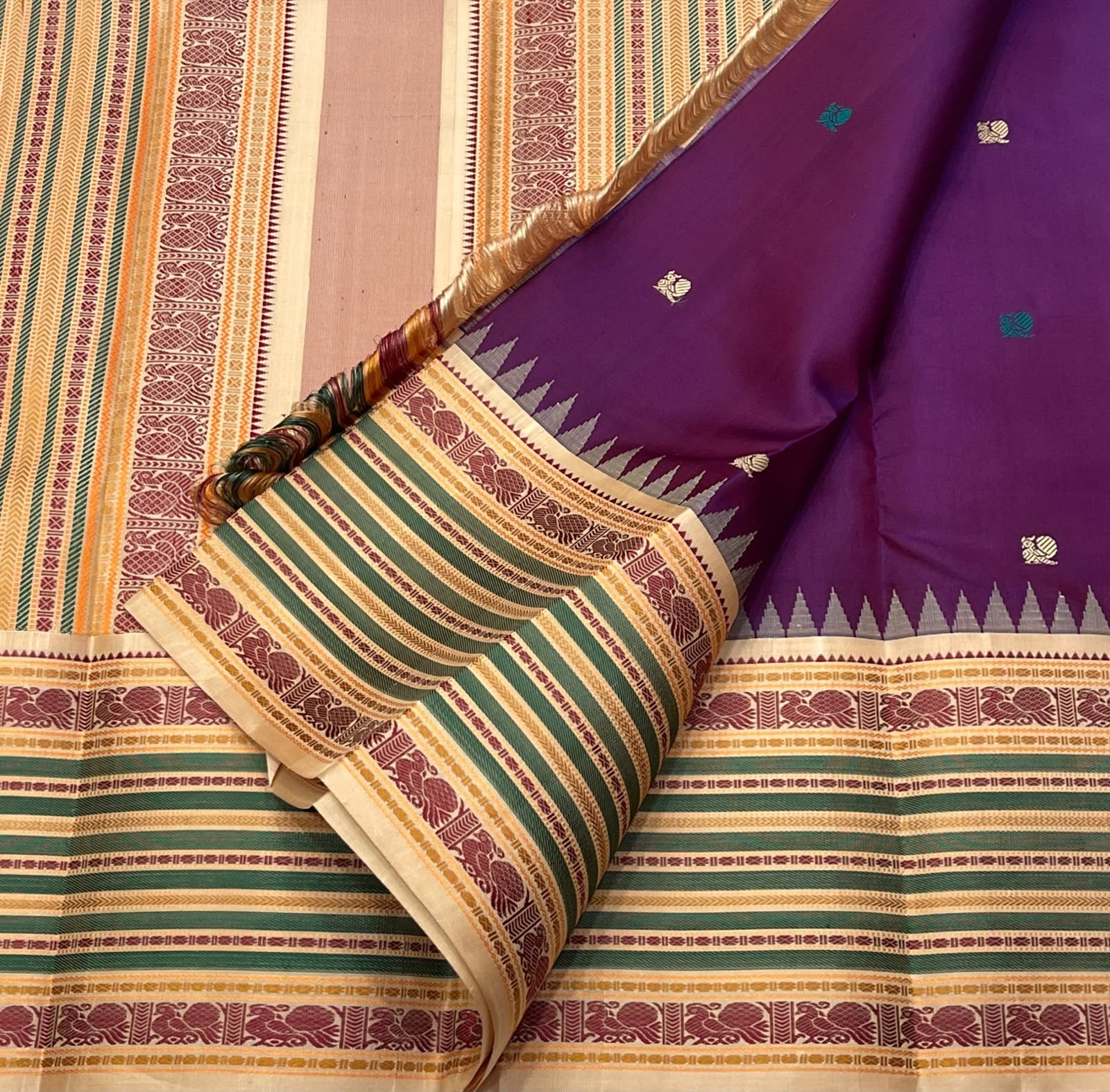 Royal Purple pure silk Kanchipuram saree — peacock thread border