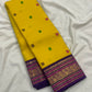 Turmeric Yellow pure silk Kanchipuram saree — peacock zari border