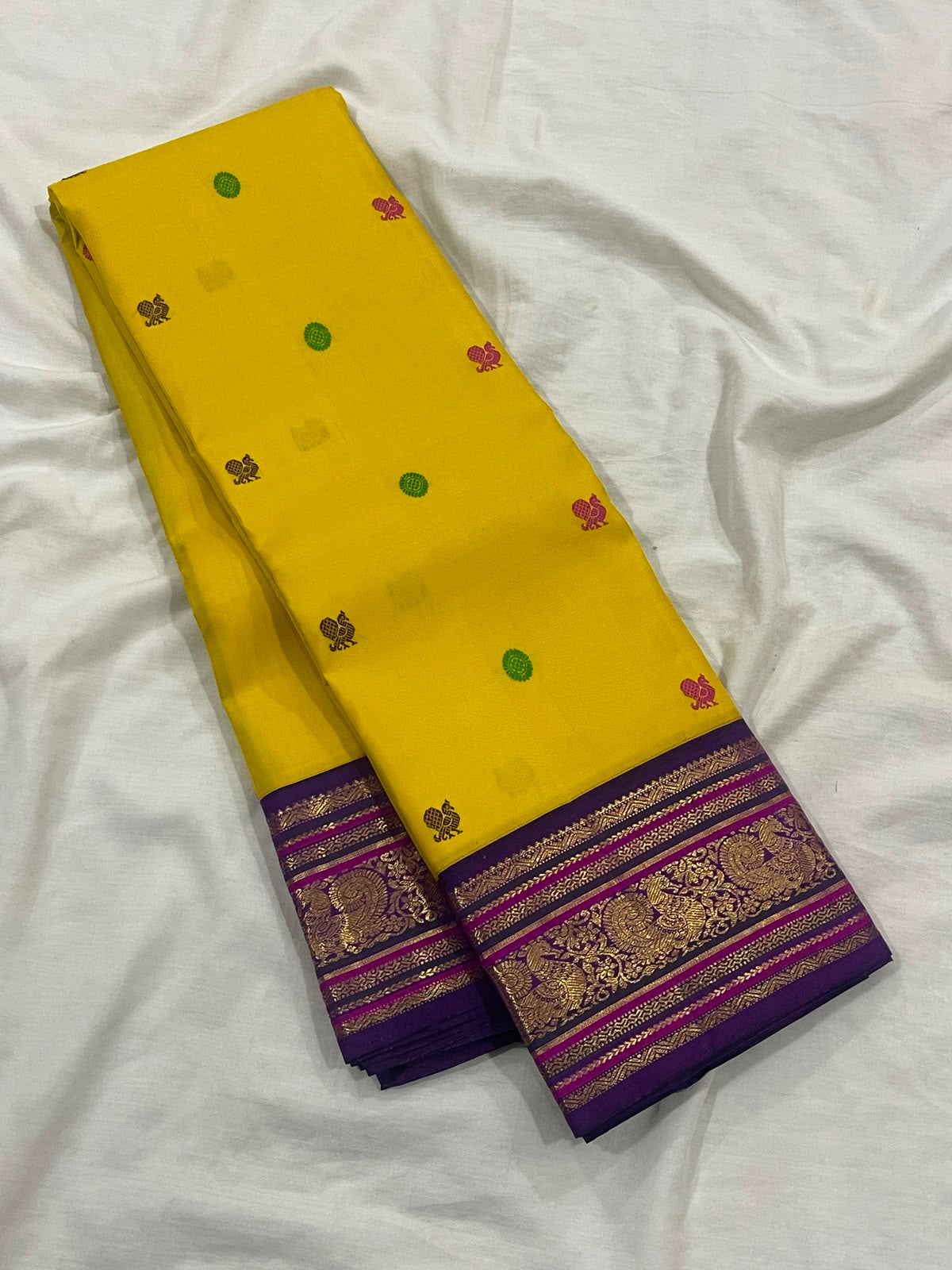 Turmeric Yellow pure silk Kanchipuram saree — peacock zari border