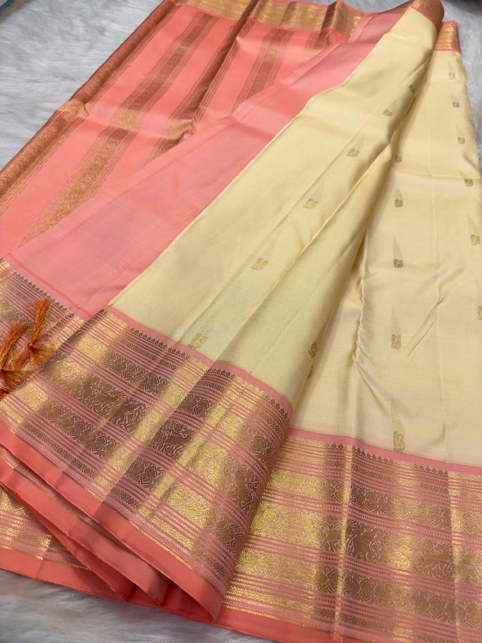 Lotus Pink and Peach Pink Kanchipuram border with classic-gold zari and fine ornamental detailing.