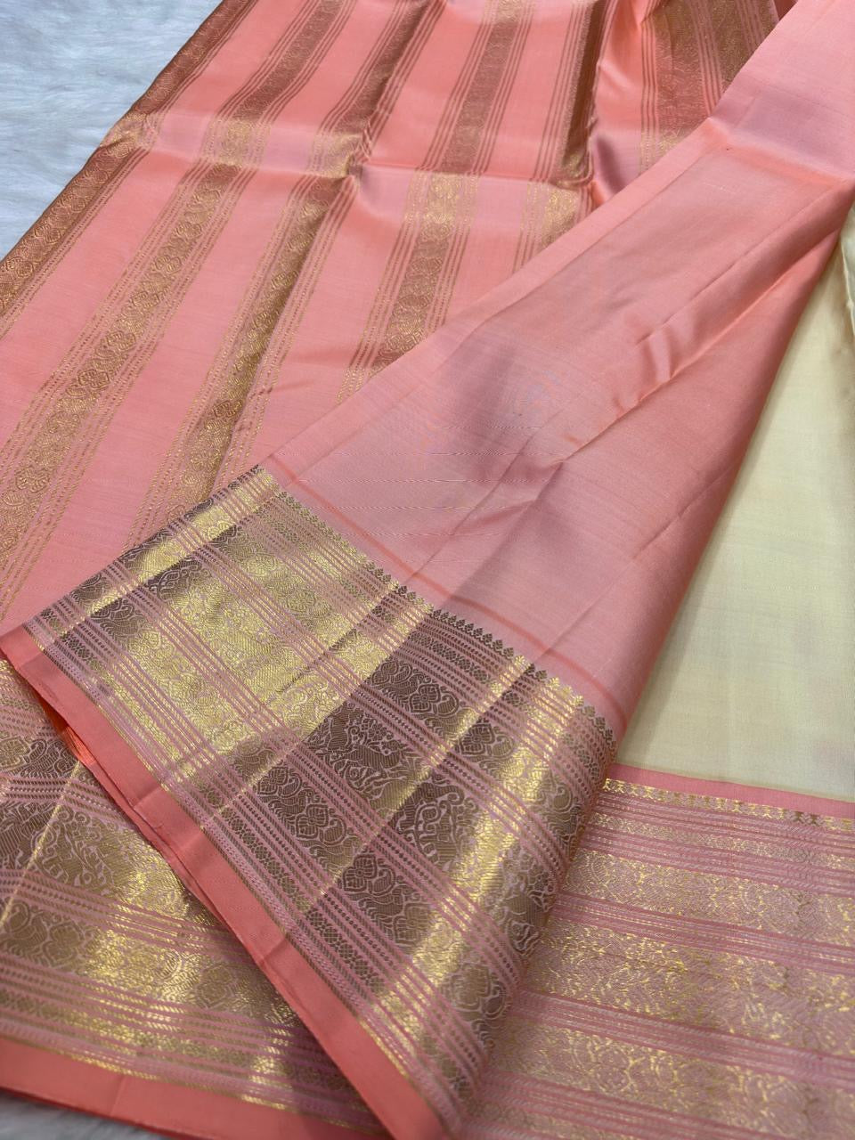 Pearl Ivory Handwoven Pure Silk KanchiPattu Butta Saree with Lotus Pink and Peach Gold Zari Border