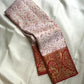 Pearl Ivory and Arakku Red Kanchipuram fusion saree with dense Banarasi-style ornamental zari work.