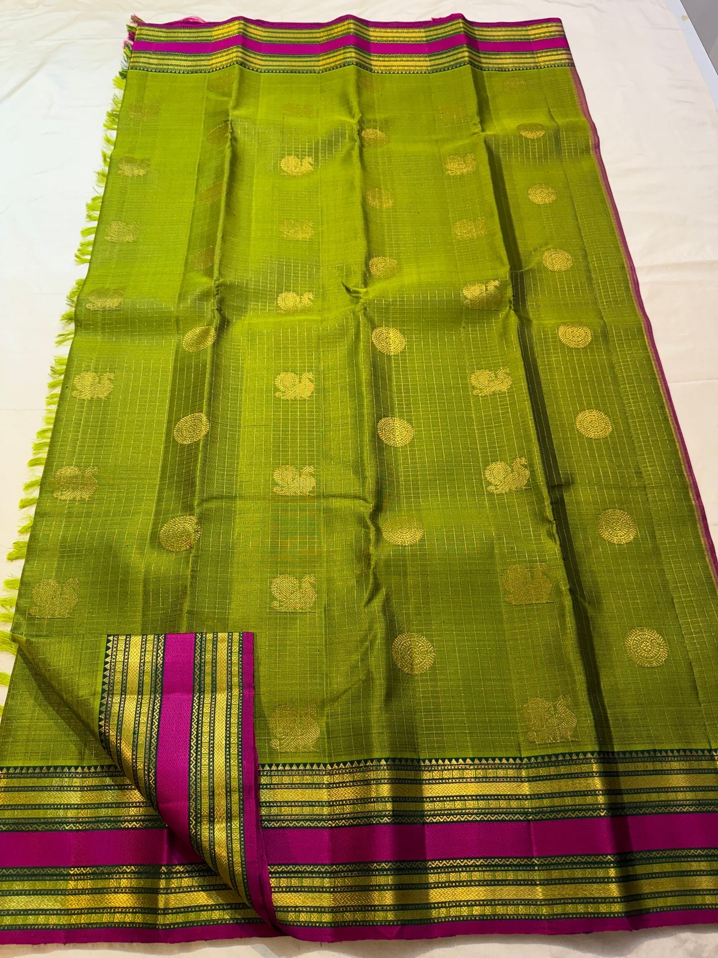 Peridot green Kanjipuram silk saree, pallu with gold zari work