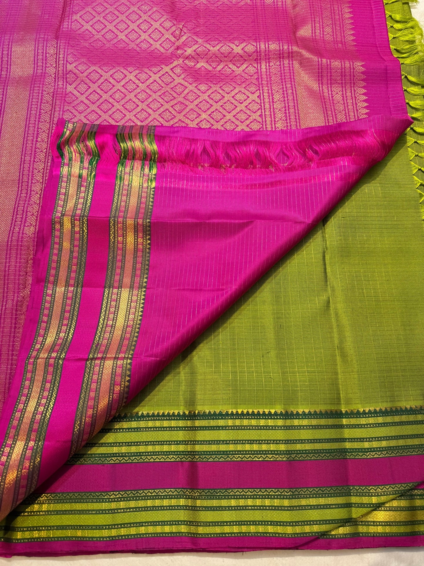 Peridot green Zari Kattam Kanjipuram silk saree, folded view