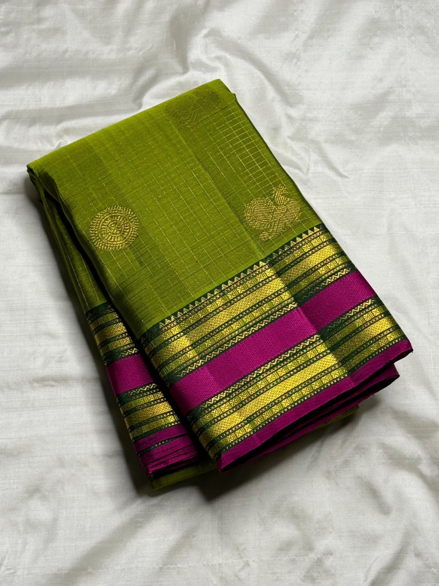 Peridot green Kanjipuram silk saree, Kamalam and Maanga zari buttas close-up