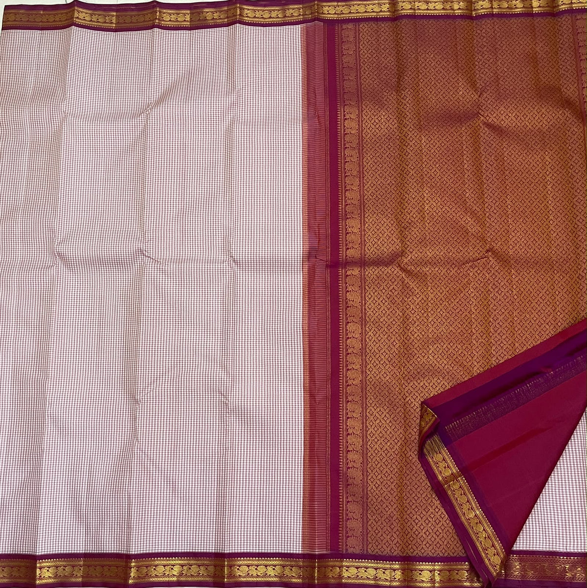 Red and Ivory Handwoven Pure Silk Kanchipuram Saree with Mini Kattam and Arakku Border, folded saree presentation