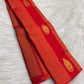 Close view of petite floral zari buttas on vermilion pure silk