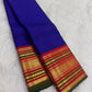 Pillar-box red border close-up, royal-blue Kanchi Pattu Korvai saree