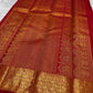 Close body view showing small spaced gold zari buttas across Pillar-Box Red silk