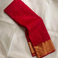 Border detail showing multiple gold zari bands with ornate handwoven motifs on Pillar-Box Red silk