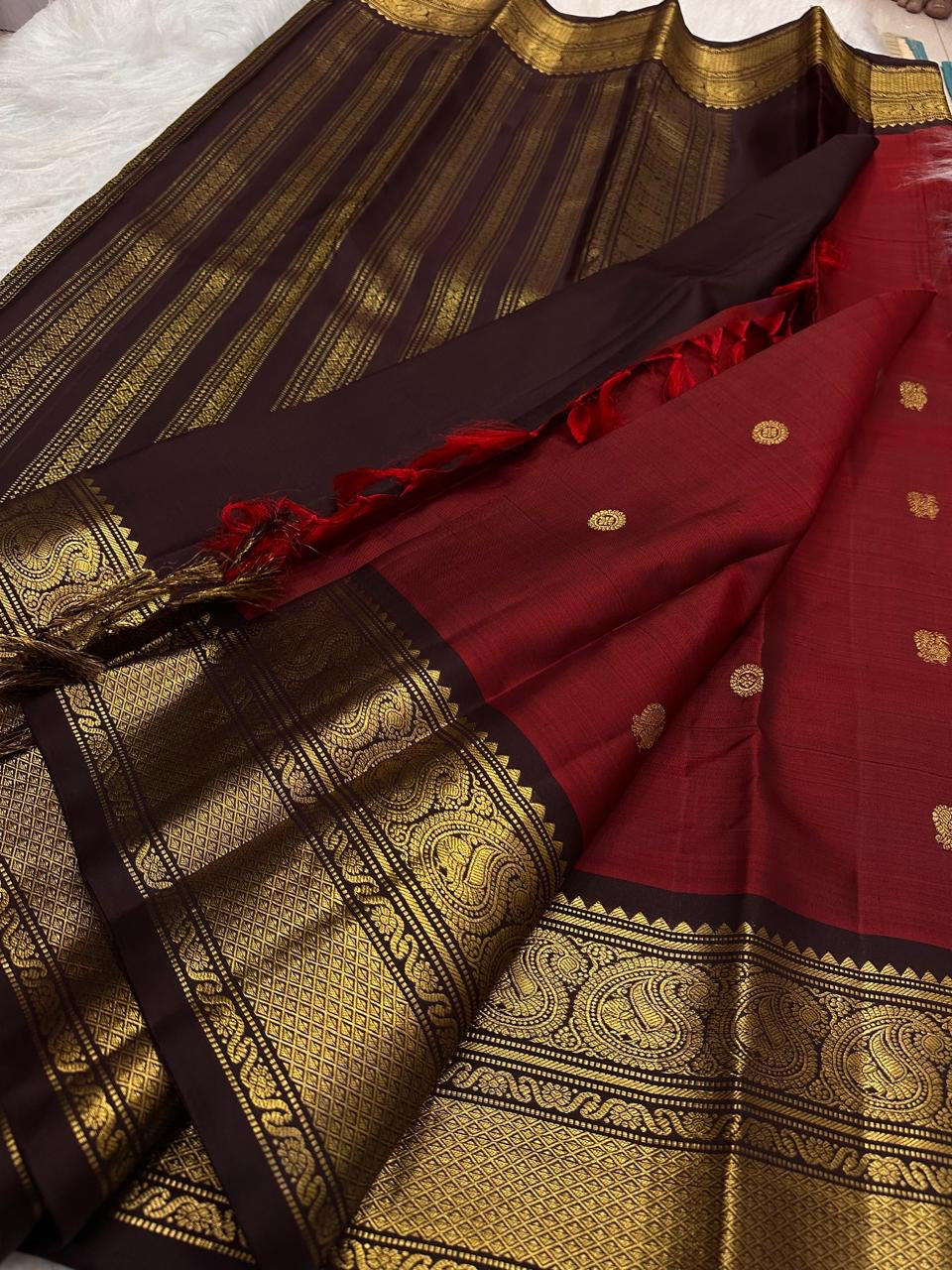 Vermilion Orange-Red Kanjipuram Saree — body close-up showing gold zari buttas