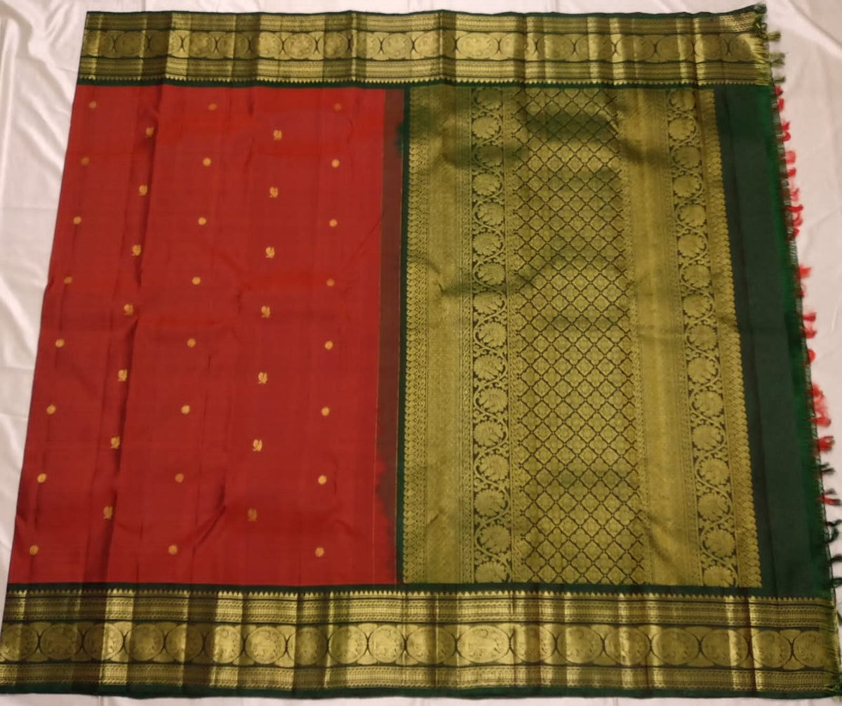 Handwoven red Kanjivaram saree with antique gold zari buttas