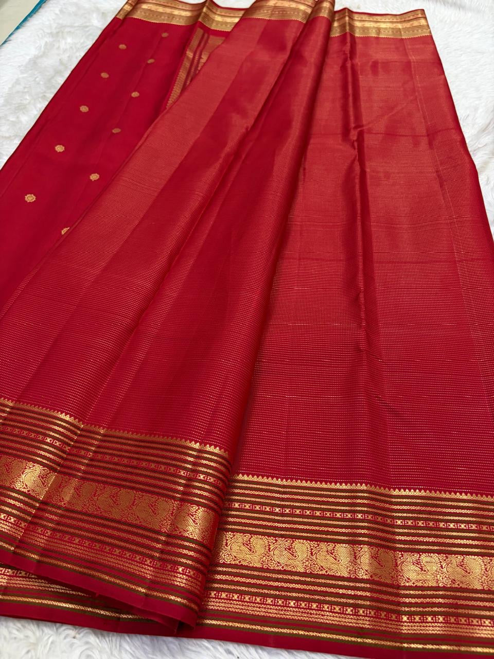 Full spread red Kanjivaram silk saree with zari butta pallu and varisaipet border Idam Living