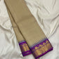 Pillayar Reku zari border detail on the warm ivory taupe Kanchipuram saree