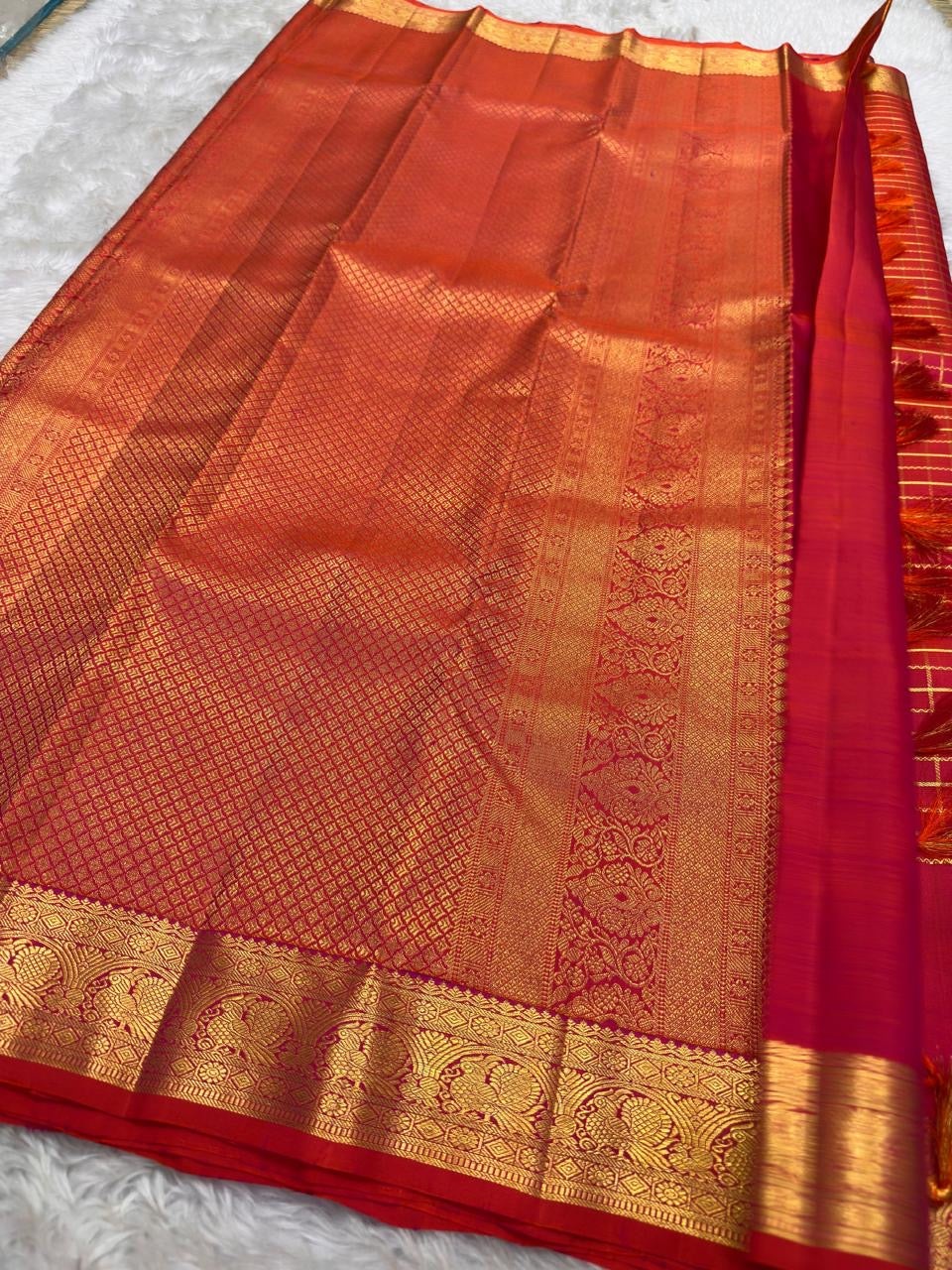 Antique-gold check pattern detail on Chilli Reddish Pink pure silk Kanjivaram saree.