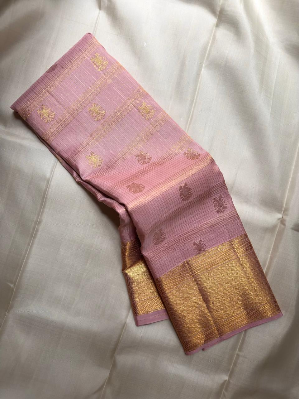 Dusty Rose Pink Kanjeevaram saree close-up showing pink and gold Gandaberunda butta zari motifs
