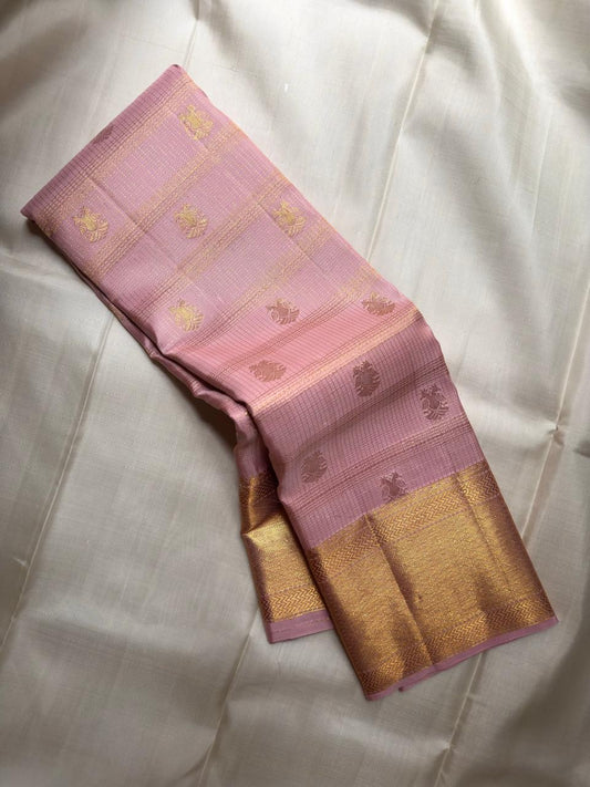 Dusty Rose Pink Kanjeevaram saree close-up showing pink and gold Gandaberunda butta zari motifs