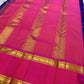 Pure Kanchipuram silk saree flat lay with blue body woven in gold checks and vibrant pink zari border finished with tassels