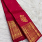 Close view of antique-gold zari buttas on Sindoor Red Kanjivaram silk.