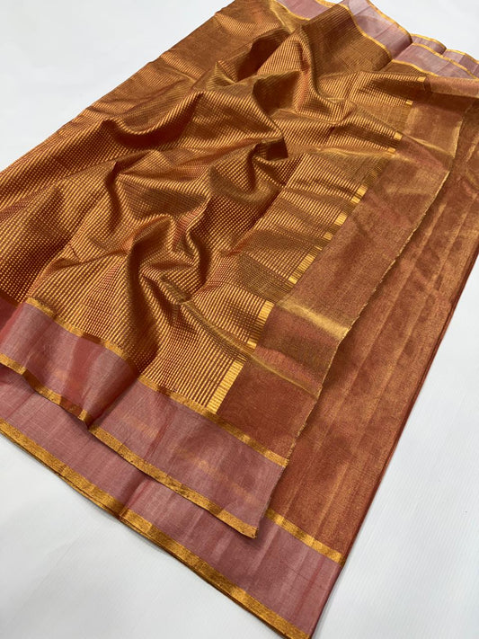 Handloom saree folded neatly showing border and fabric texture