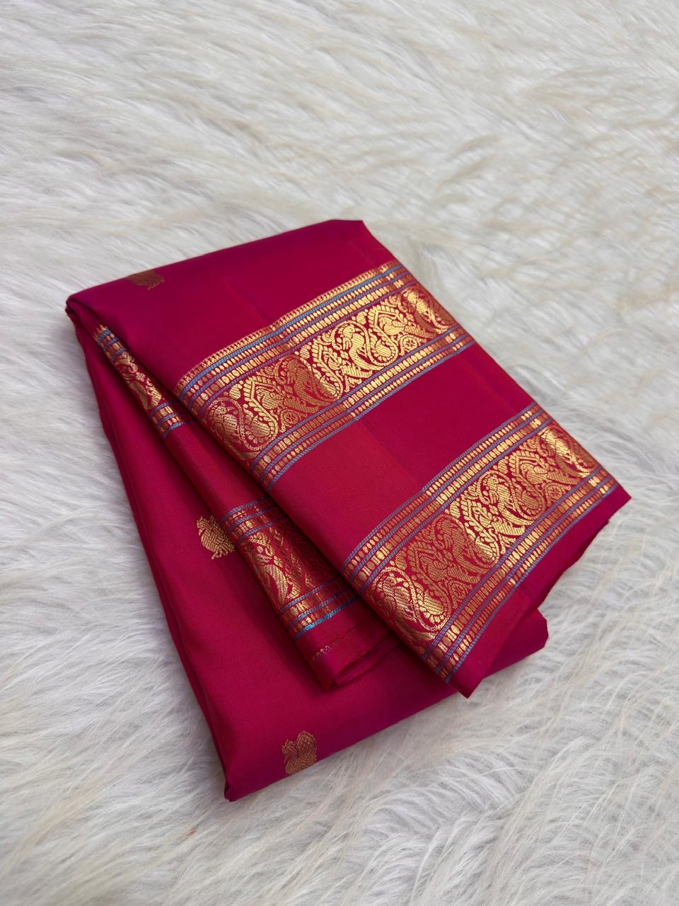 Pomegranate Pink Kanchipuram silk saree with petite scattered gold zari buttas
